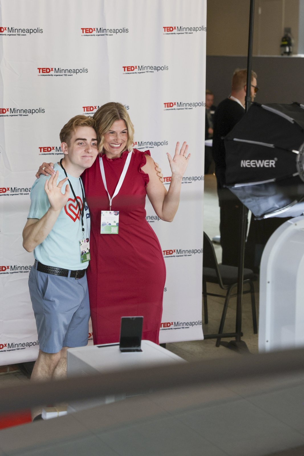 Katherine and her son Nicolas at the TEDxMinneapolis photo wall