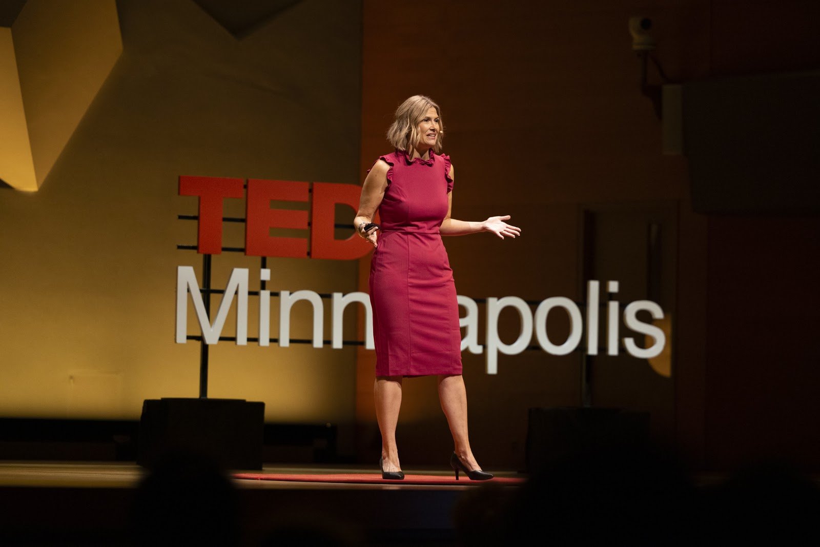 Katherine gesturing while speaking at TEDxMinneapolis