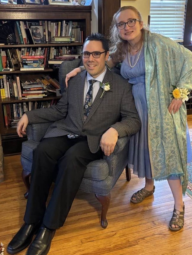 Eric and Maeve posing together at home before an event