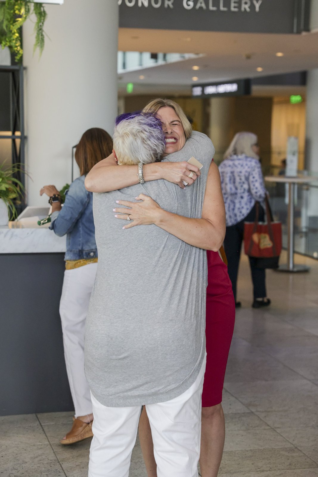 Guests embracing at the TEDxMinneapolis reception