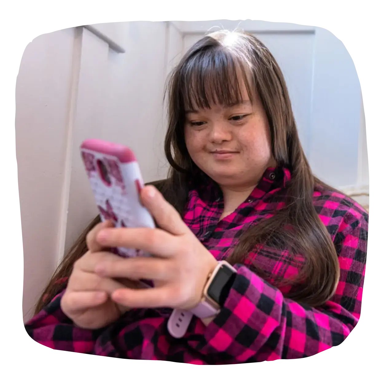 Woman with intellectual disabilities using a mobile phone